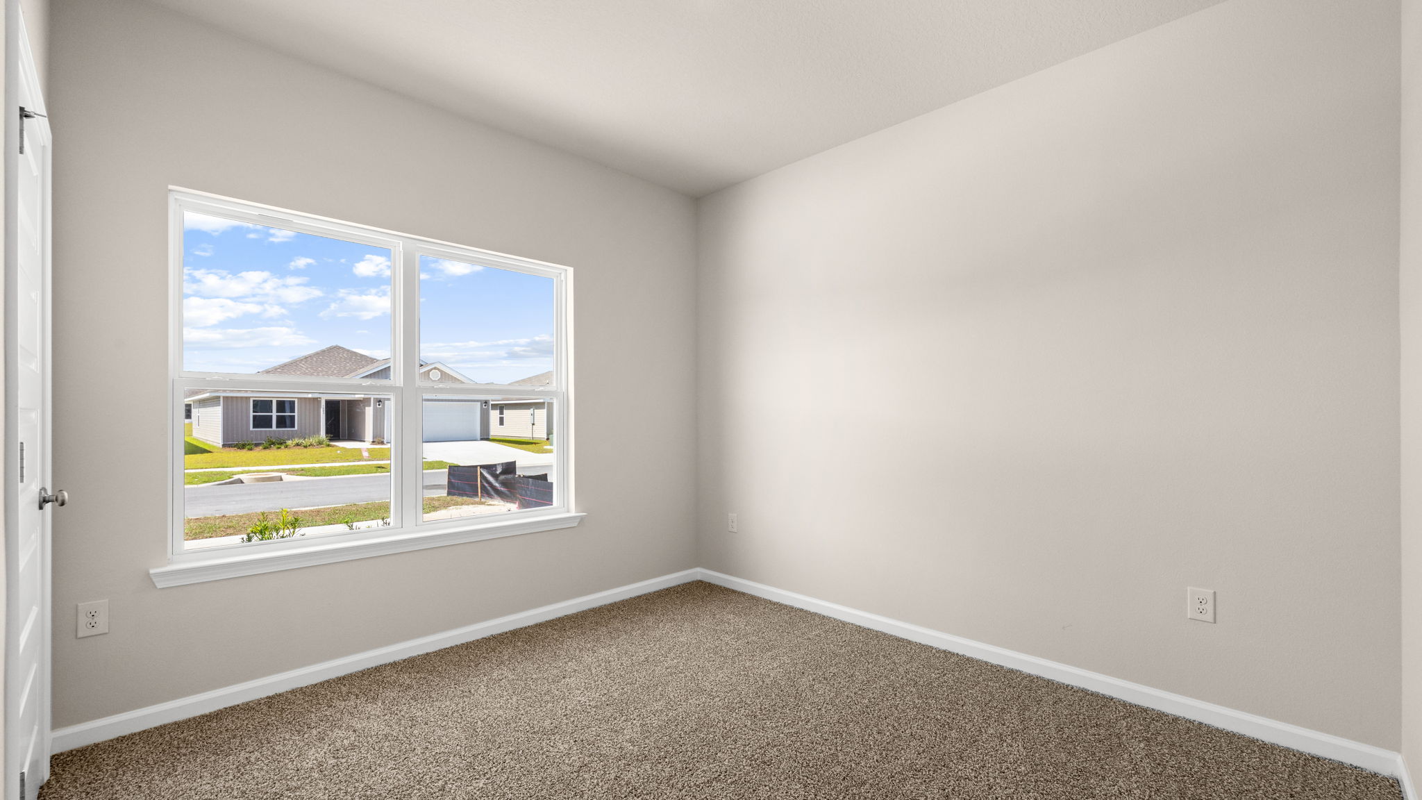 Bedroom with carpet floor and window and closet.