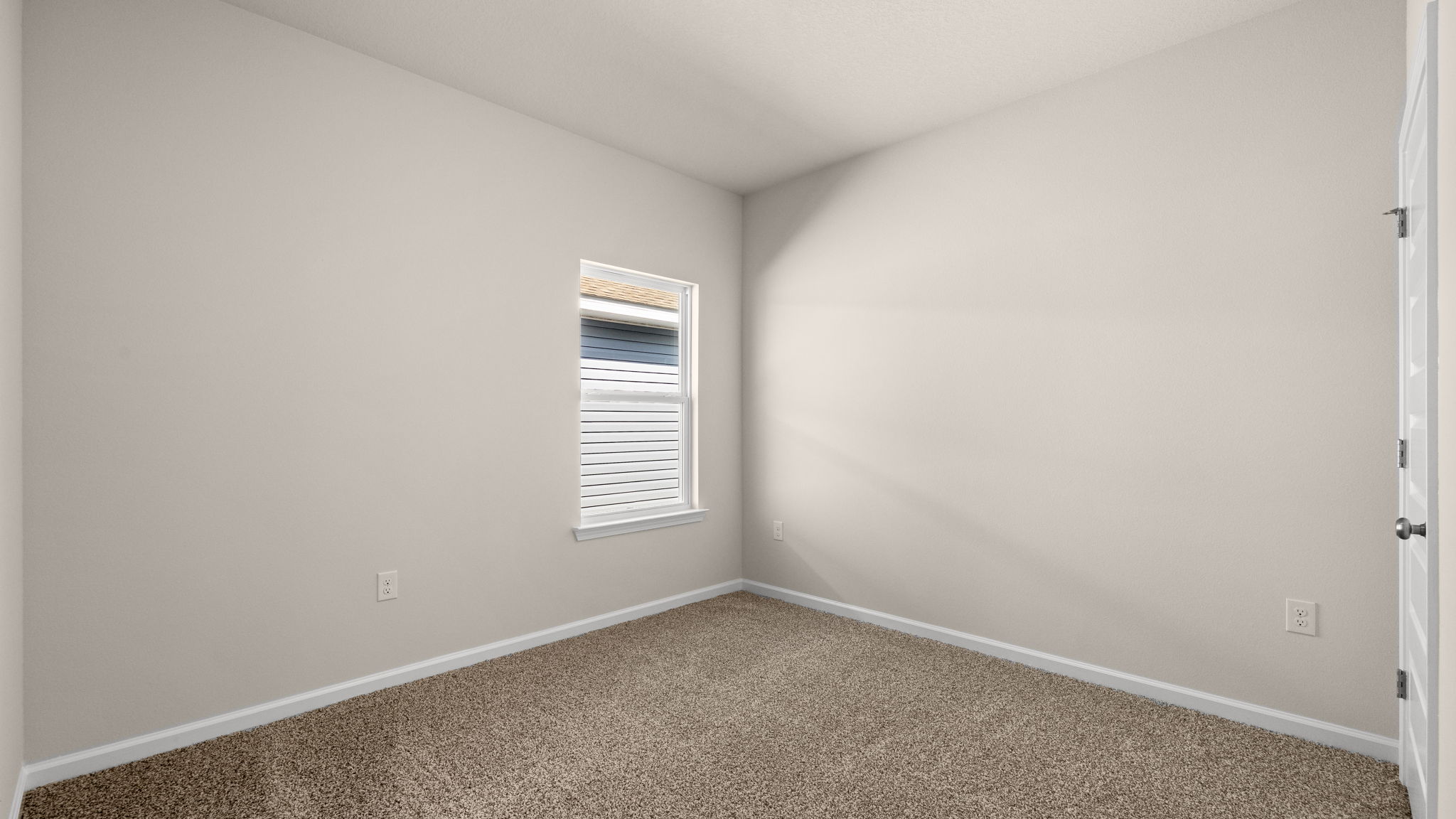 Bedroom with carpet floor and window and closet.