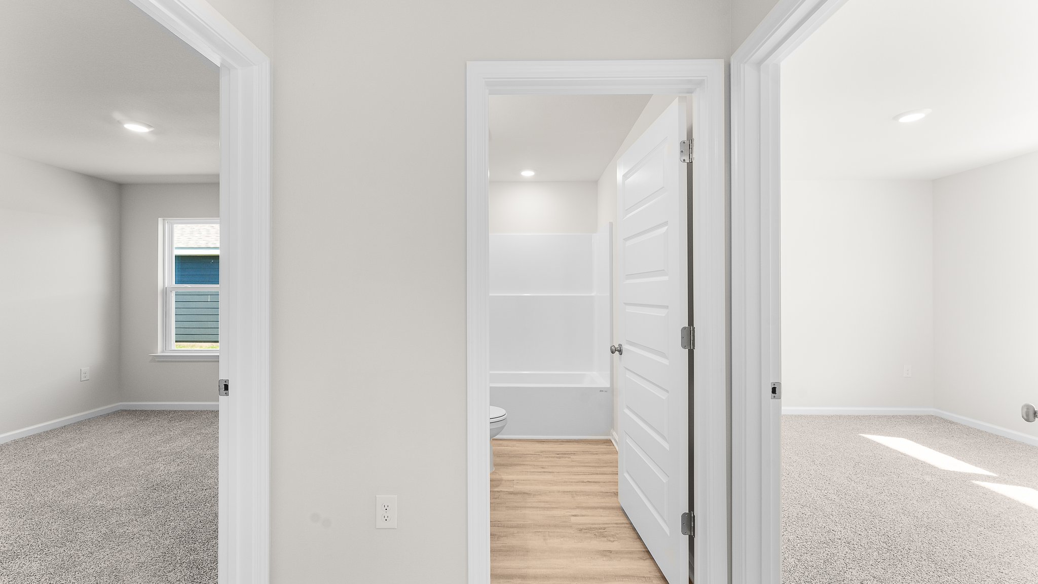 Hallway next to bathrooms and bedrooms.