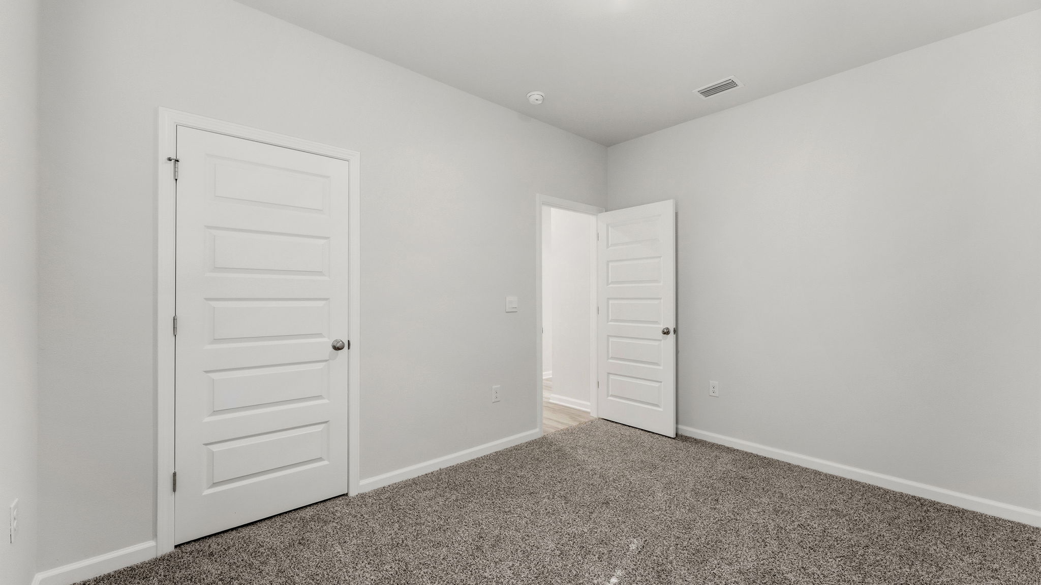 Bedroom with carpet floor and closet.
