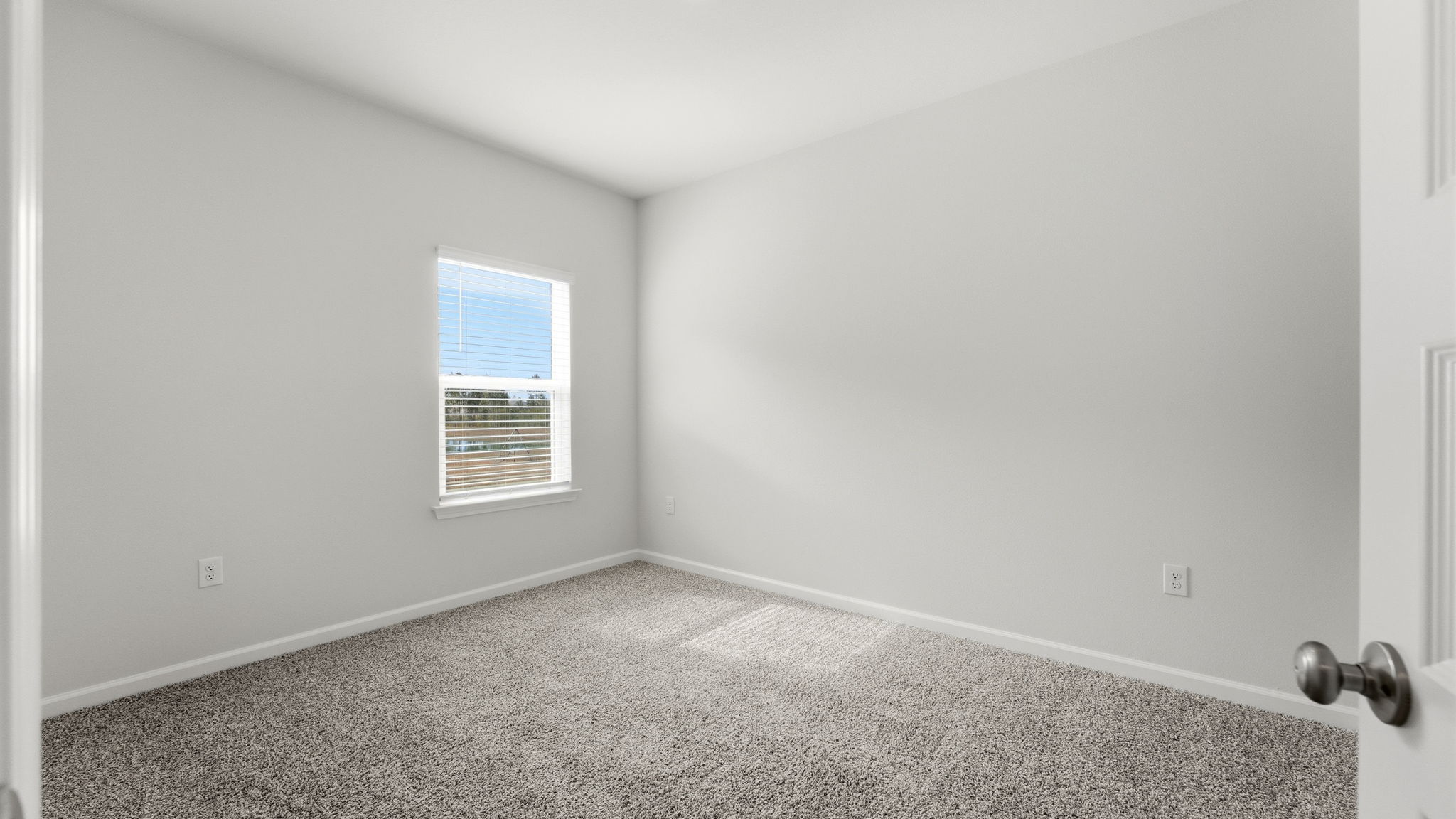 Bedroom with carpet floor and window and closet.
