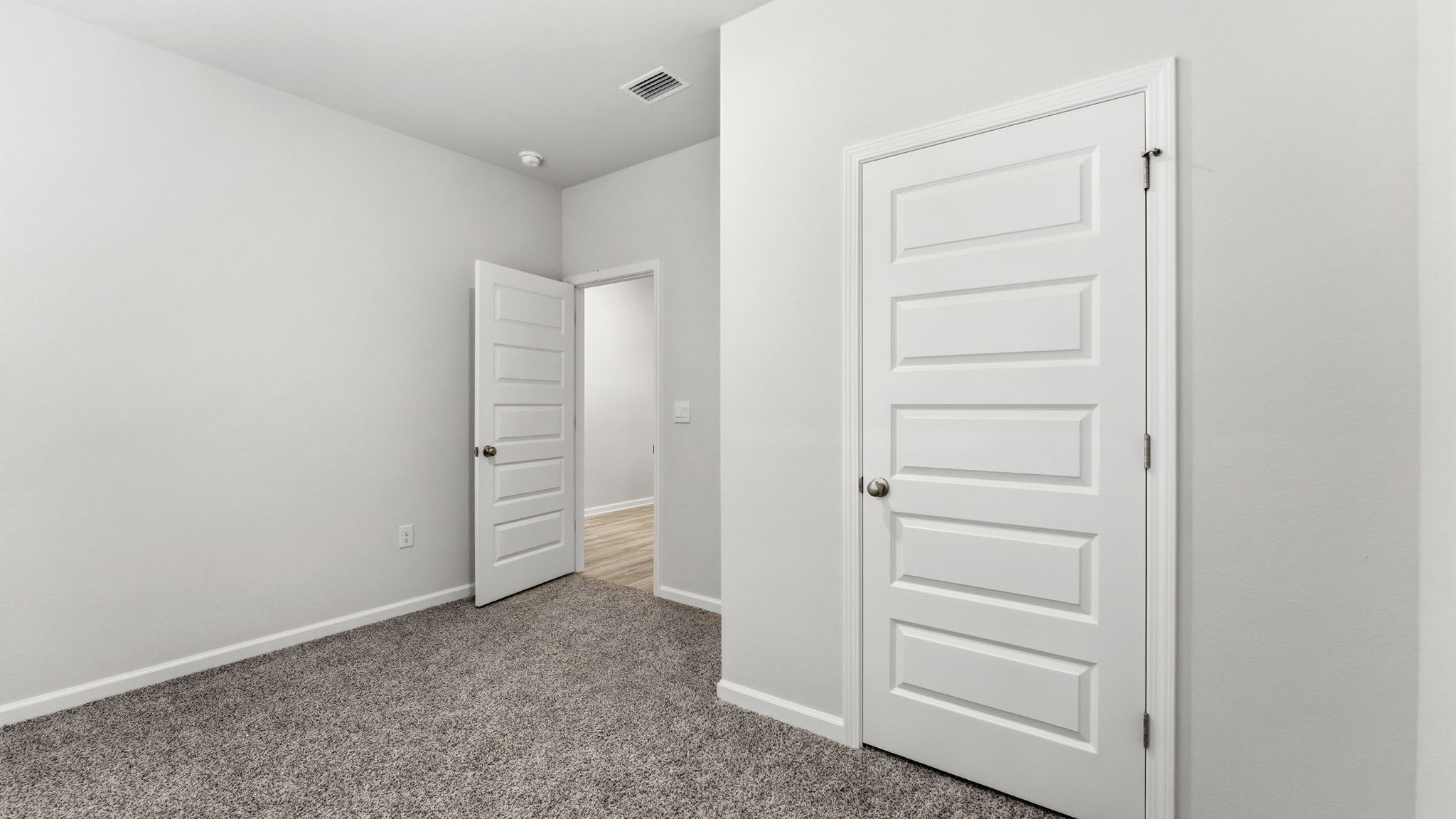 Bedroom with carpet floor and closet.