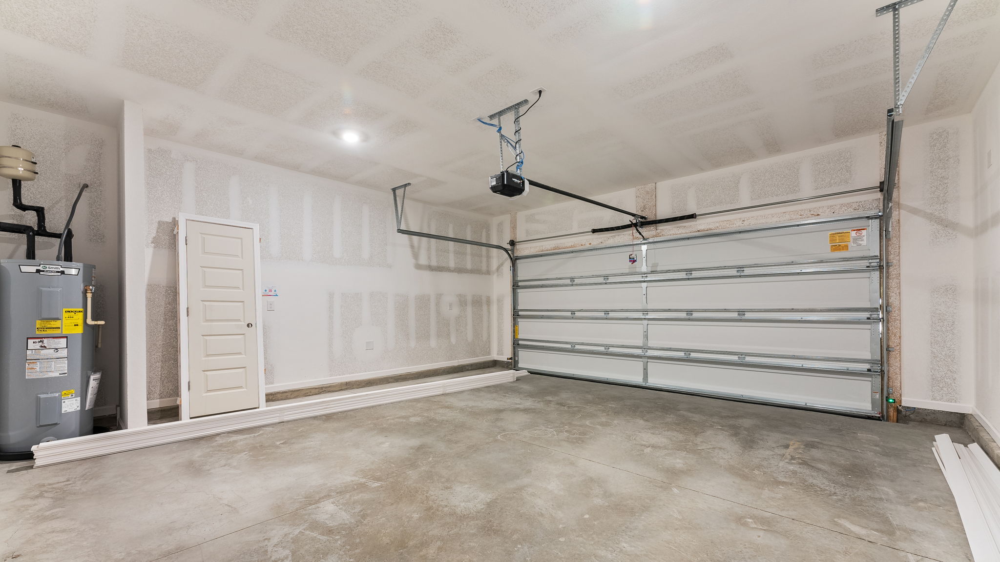 Two car garage with water heater.