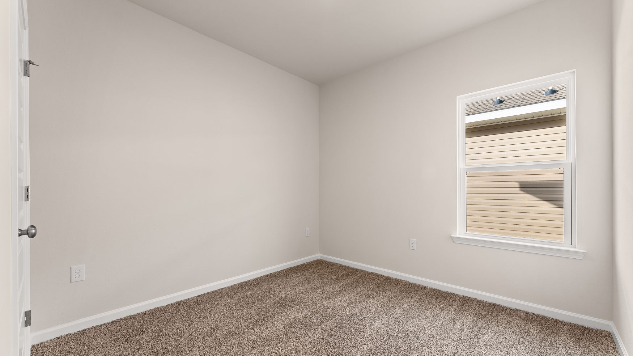 Bedroom with carpet floor and window and closet.