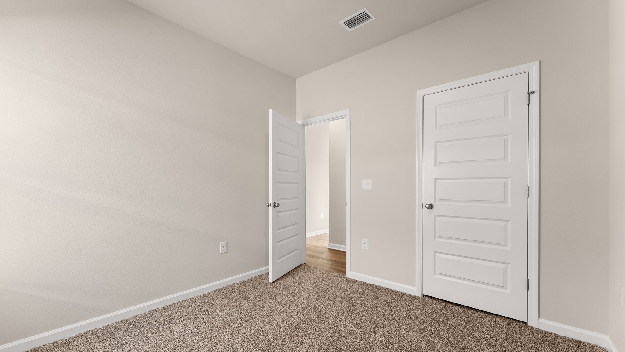 Bedroom with carpet floor and closet.