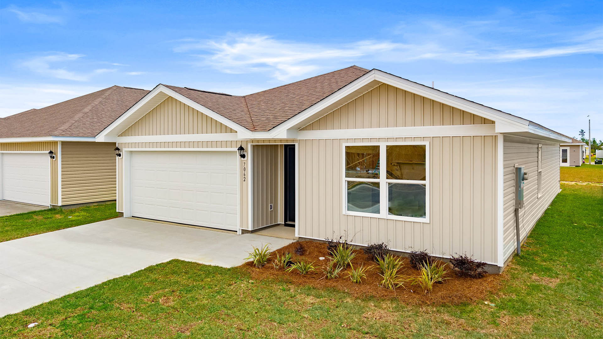 Freeport floor plan at Liberty with vinyl siding and two-car garage.