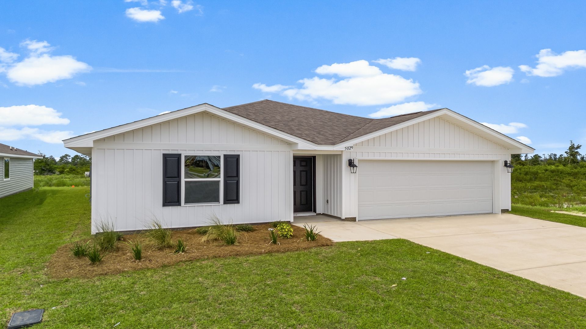 Freeport floor plan at Liberty with vinyl siding and two-car garage.