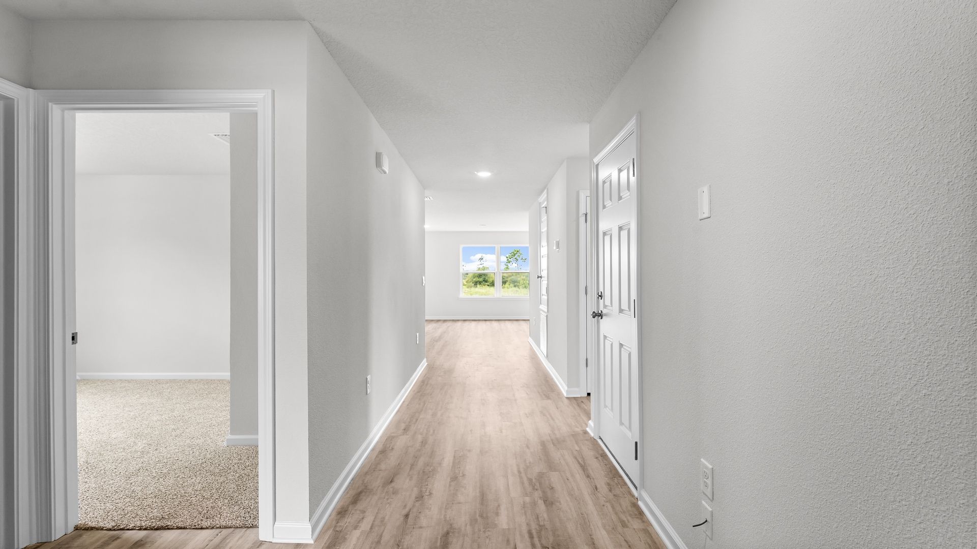 Front hallway next to bedrooms and bathroom and closet.
