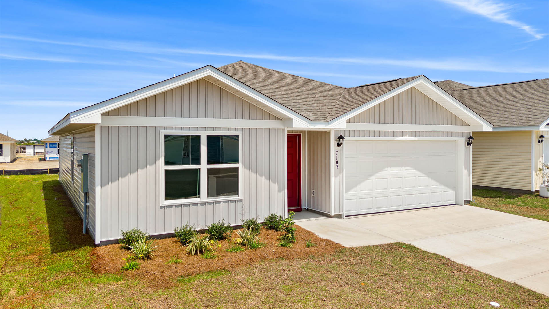 Freeport floor plan at Liberty with vinyl siding and two-car garage.