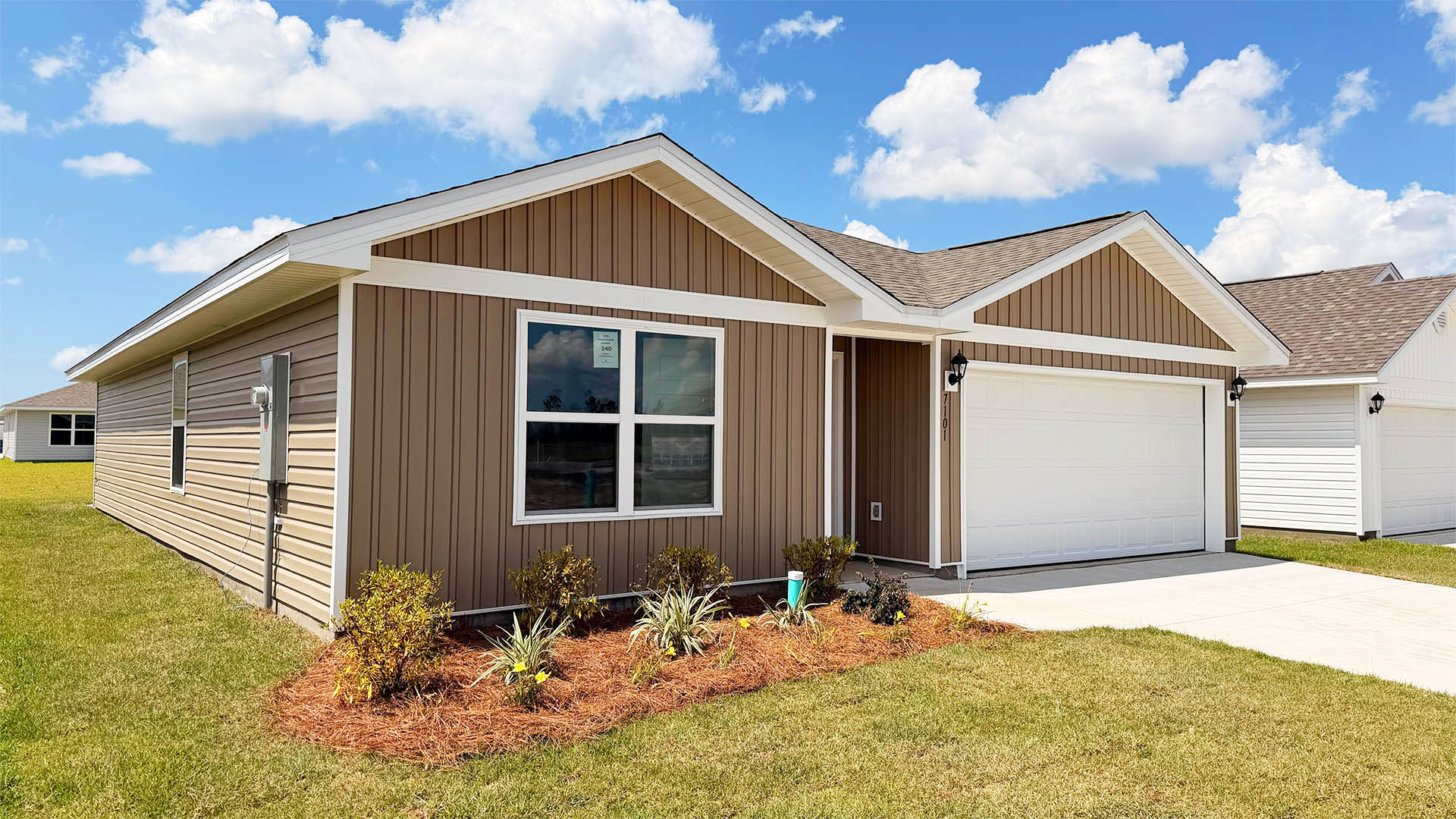 Freeport floor plan at Liberty with vinyl siding and two-car garage.
