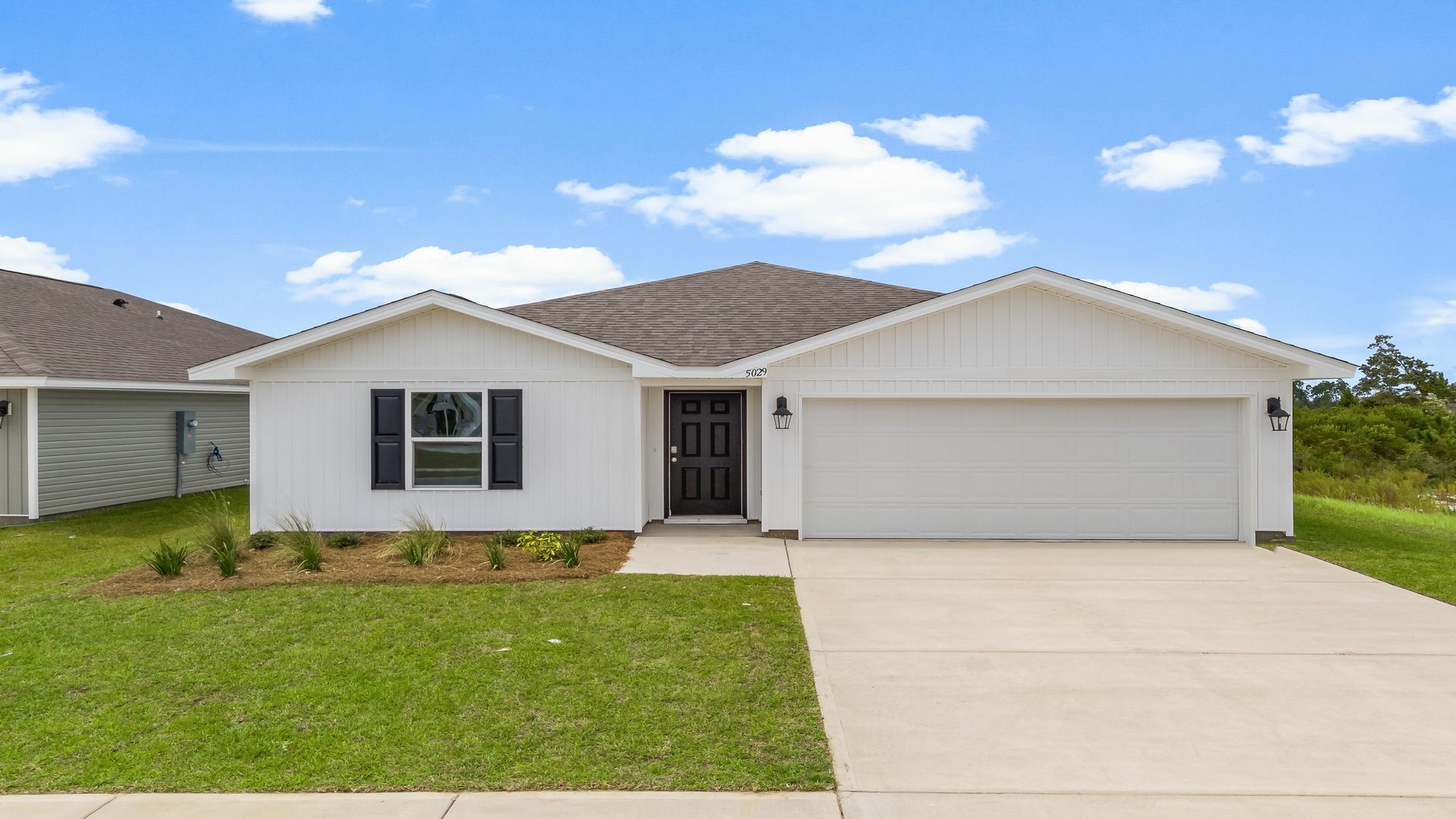 Freeport floor plan at Liberty with vinyl siding and two-car garage.