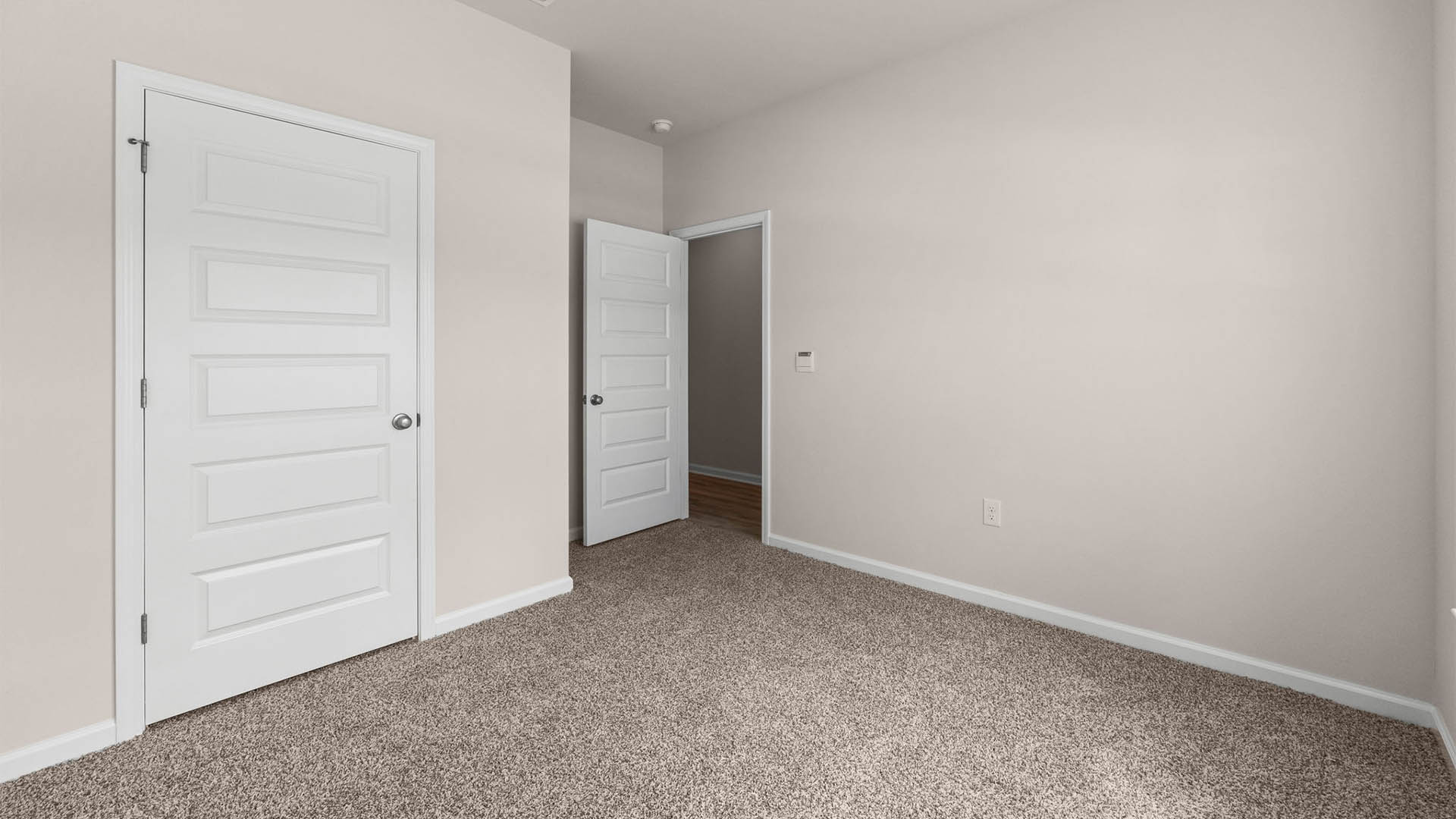 Bedroom with closet and carpet floors.