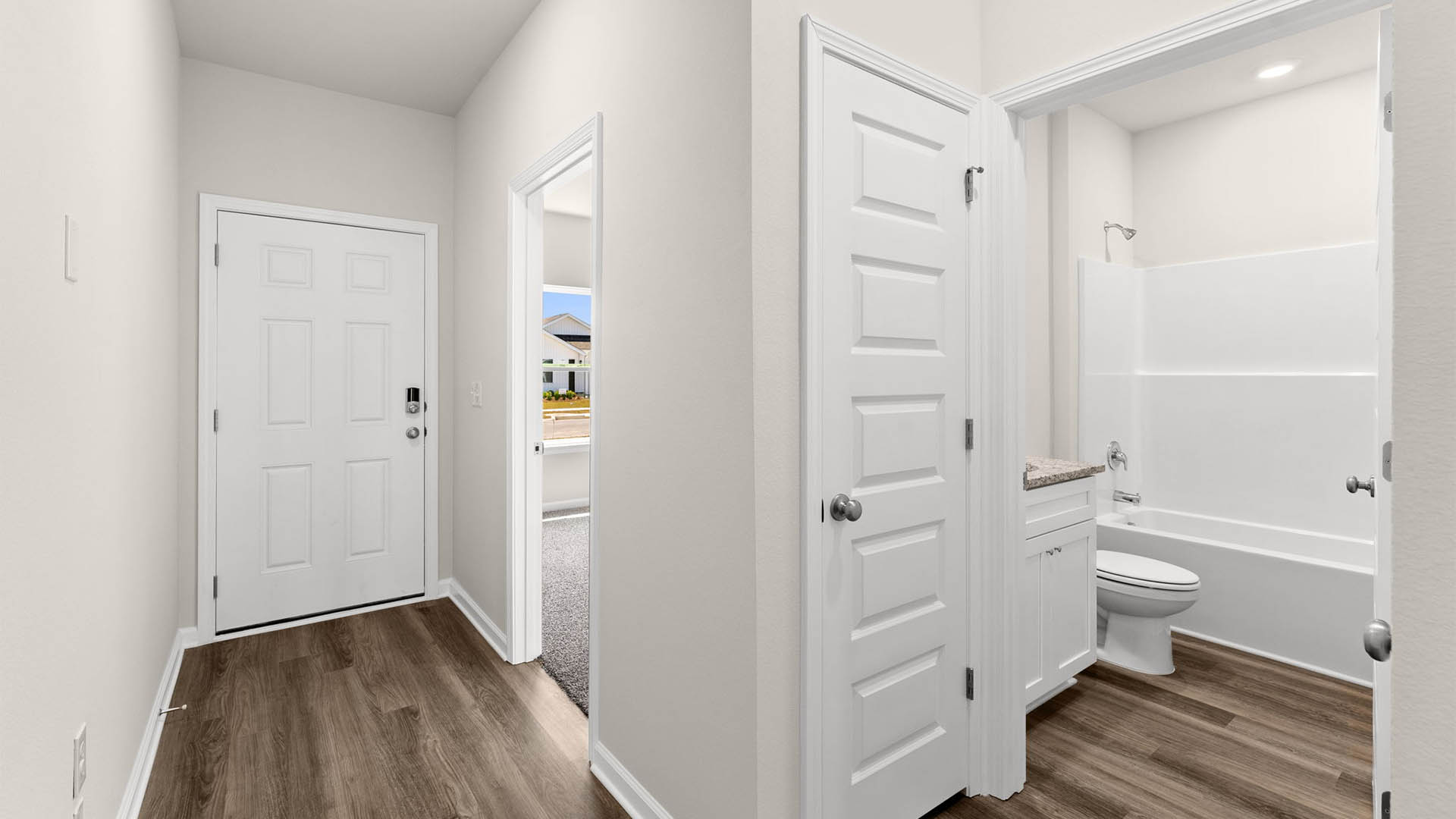 Front entrance hallway next to bedrooms and bathroom.