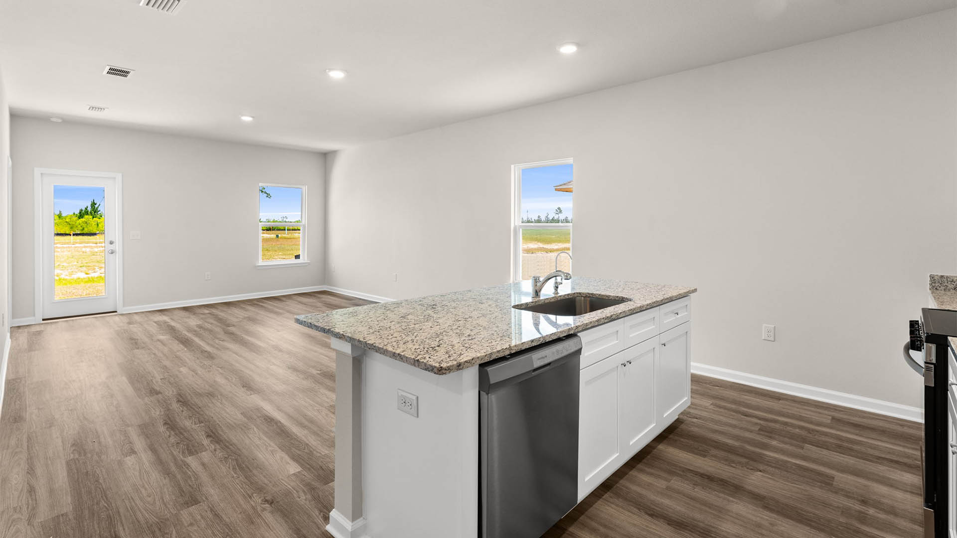 Open living room and kitchen with island.