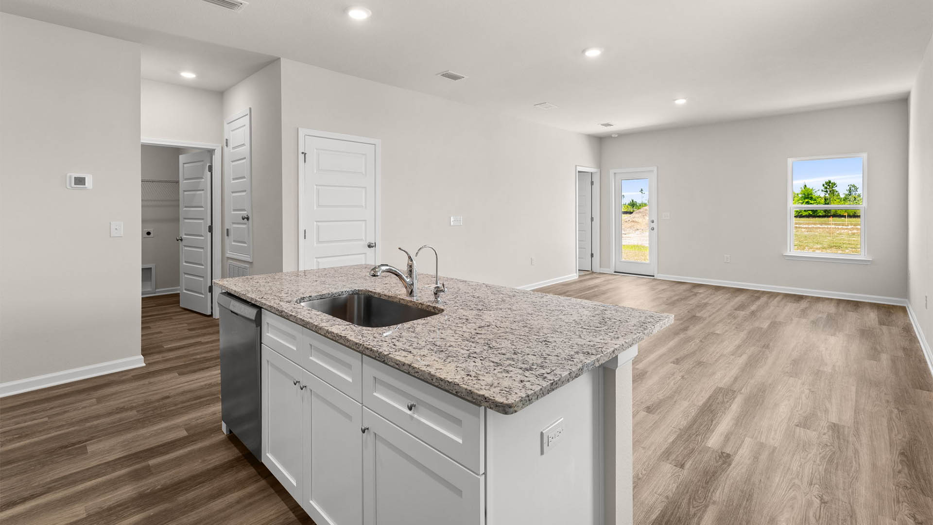 Open living room and kitchen with island.