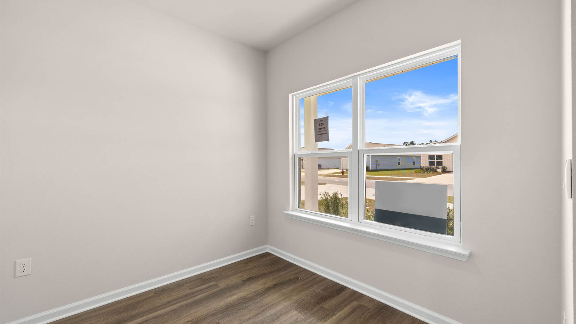Front room with EVP flooring and window.