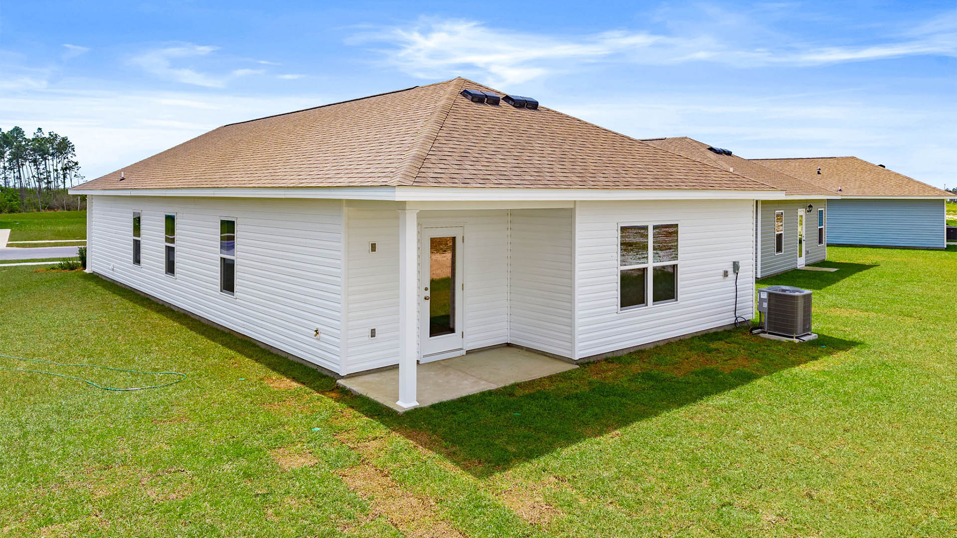 Ryker plan rear of home with covered back patio.