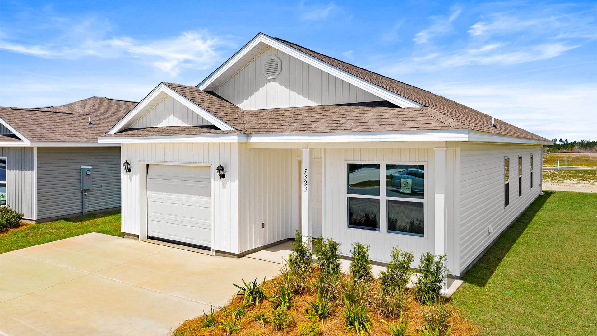 Ryker plan with vinyl siding and single-car garage.