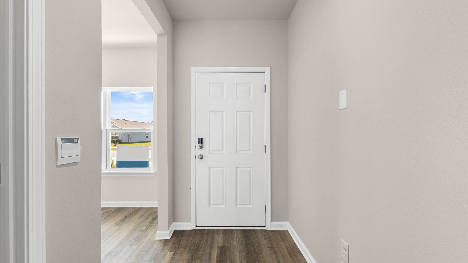 Front entrance hallway with EVP flooring and front door.