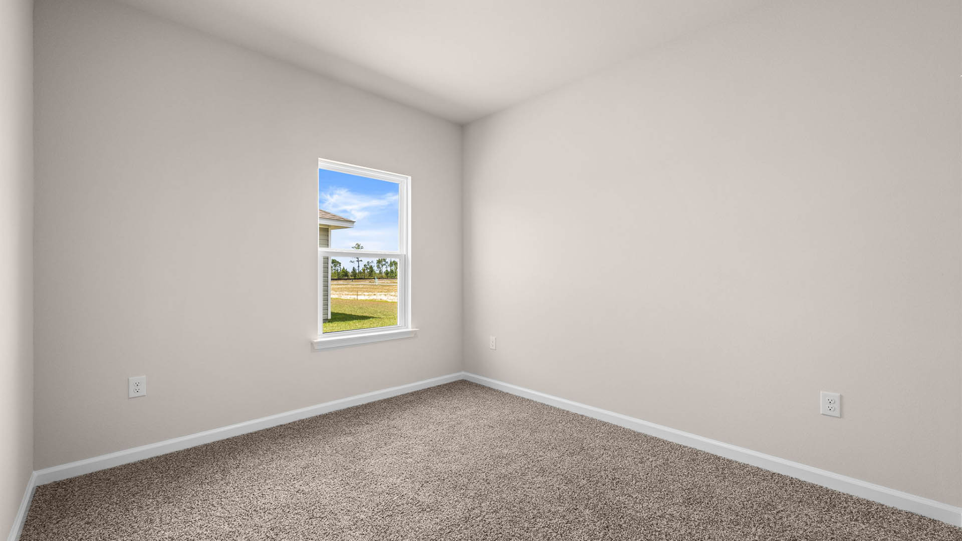 Bedroom with carpet floor and window.
