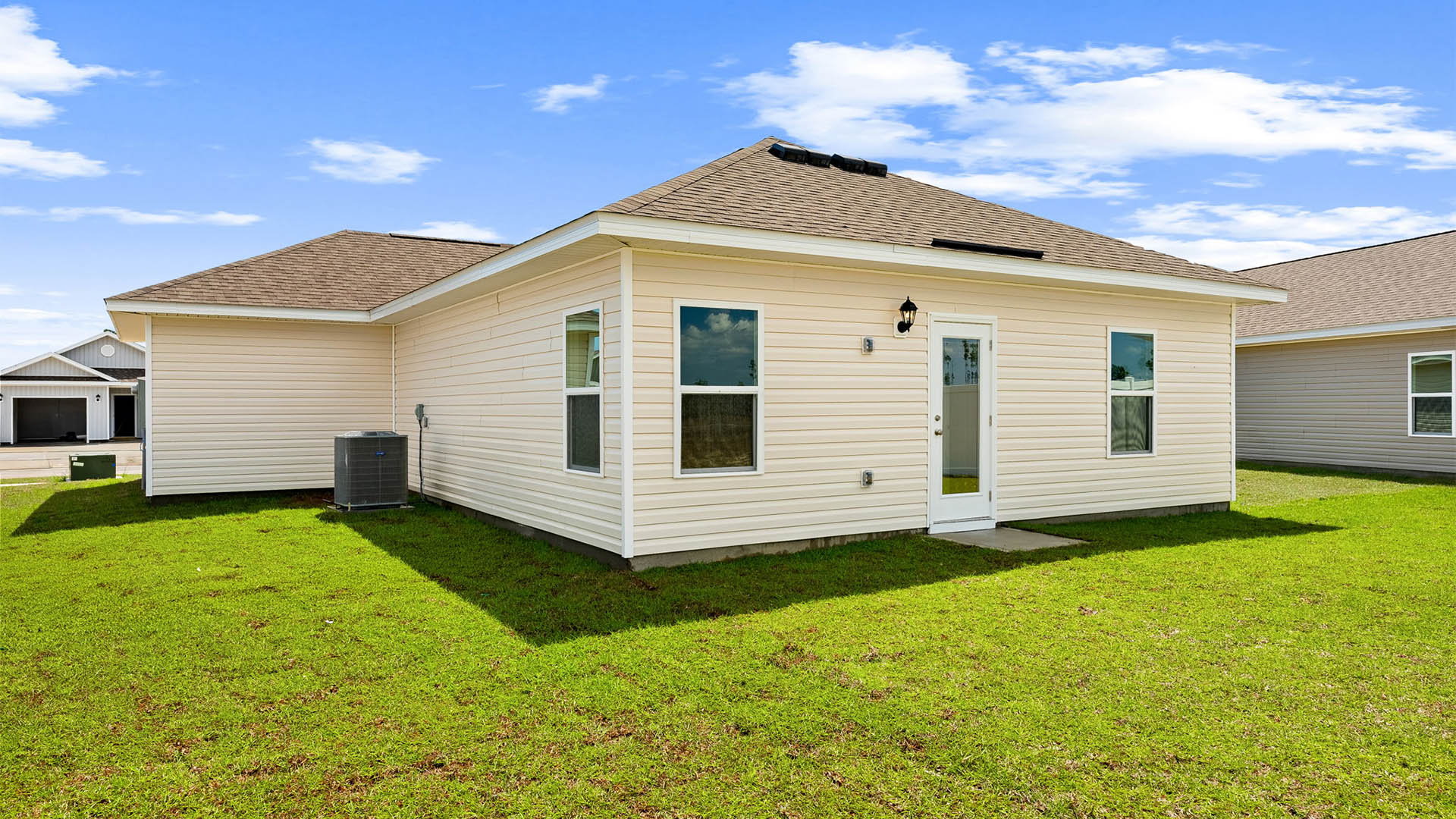 Sutton plan rear of home with back patio.