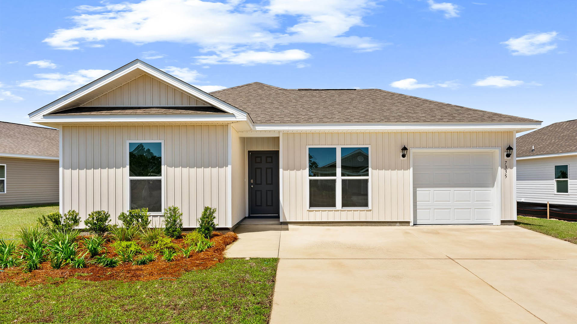 Sutton plan with vinyl siding and single-car garage.