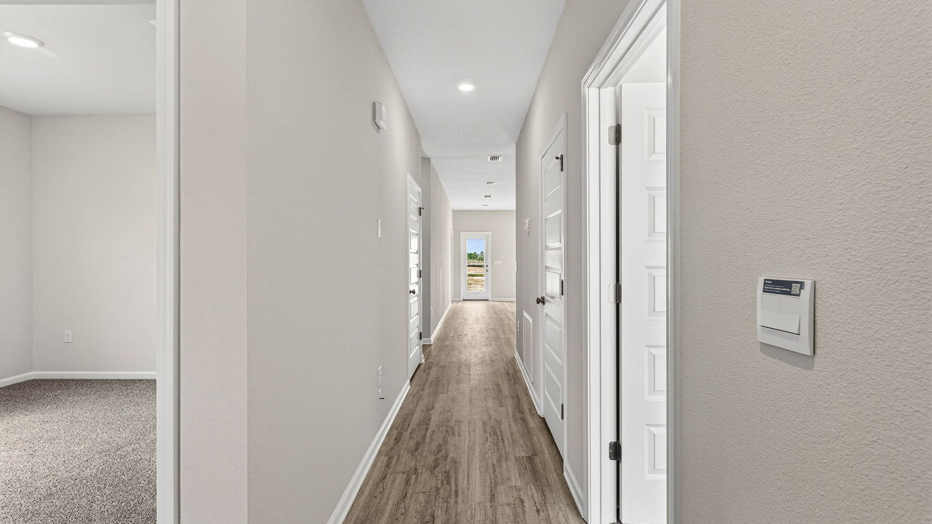 Front entrance hallway with EVP flooring and front door.