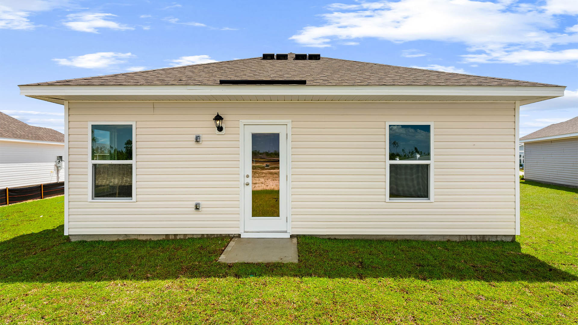 Sutton plan rear of home with back patio.