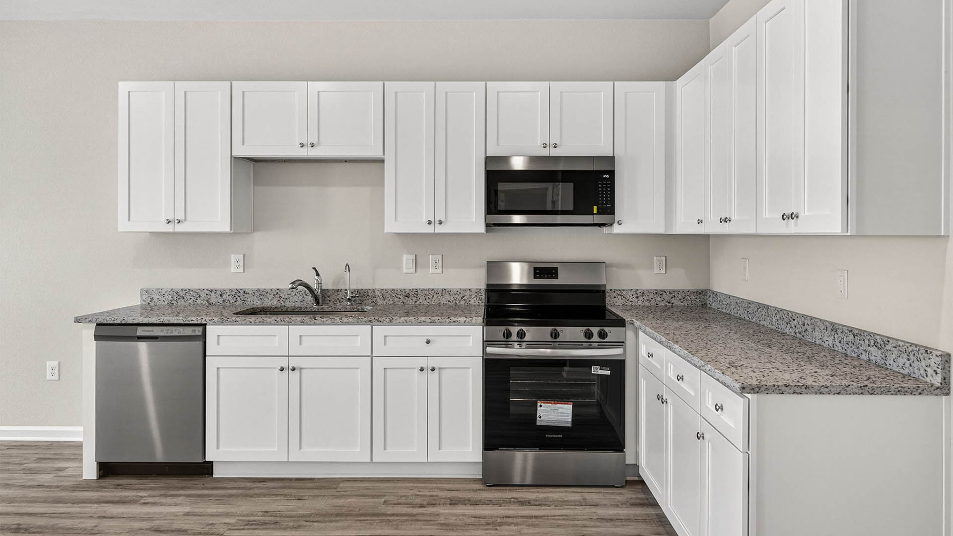Kitchen with granite countertops and stainless-steel appliances.