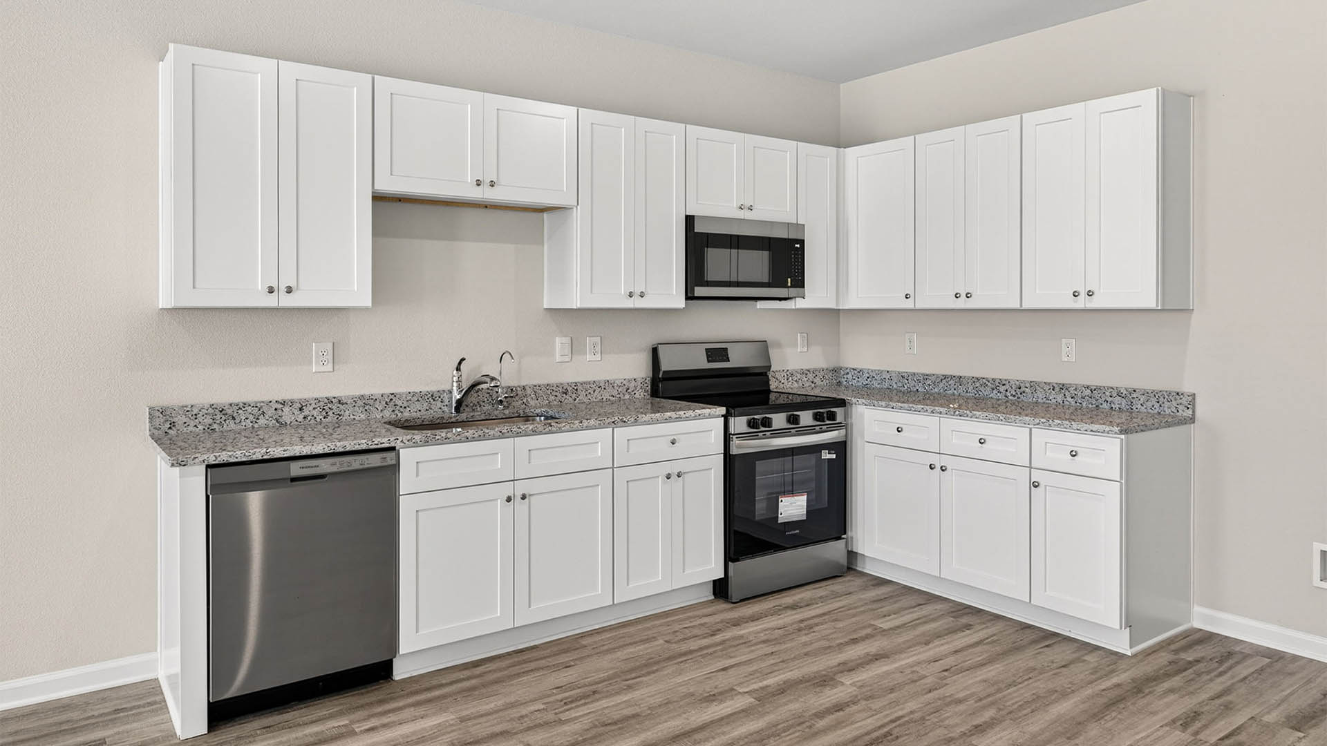 Kitchen with granite countertops and stainless-steel appliances.