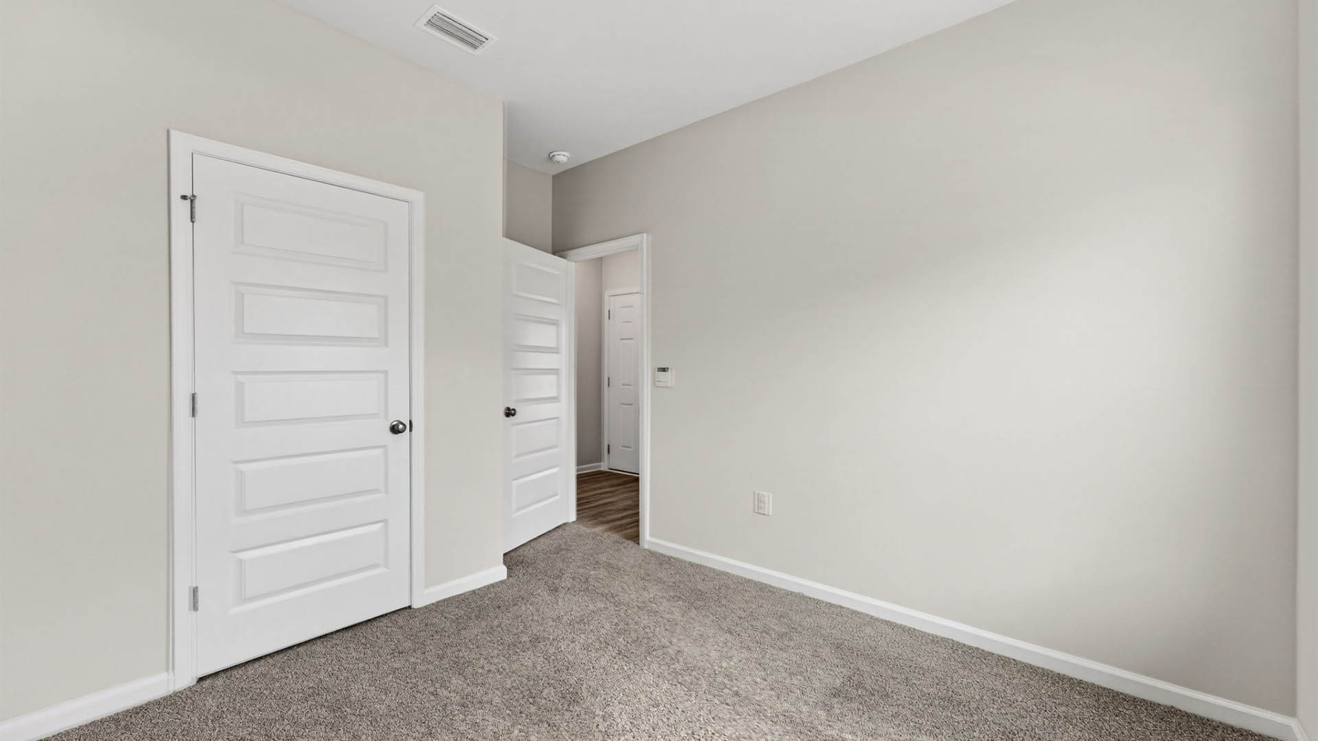 Bedroom with carpet floor and closet.
