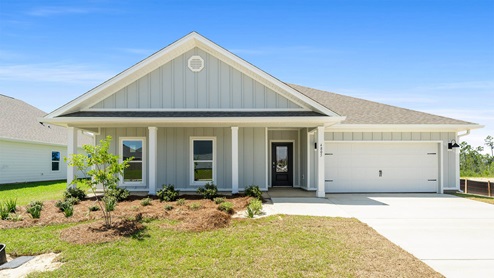 Victoria floor plan at Titus Park with two car garage and covered front porch.