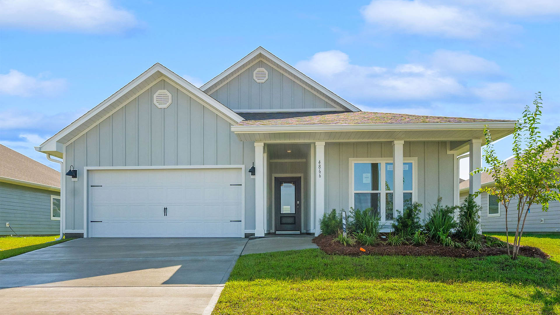 Delray floor plan at Titus Park front of home with two car garage.