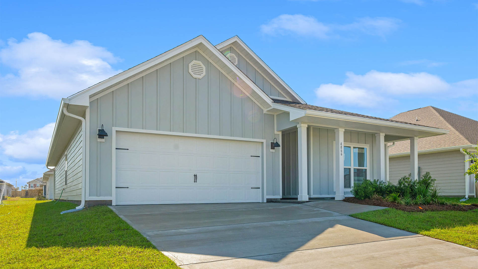 Delray floor plan at Titus Park front of home with two car garage.