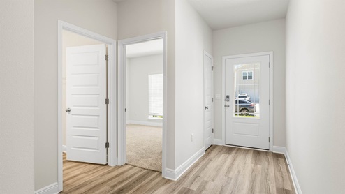 Front door entrance next to bedrooms and guest bathroom.