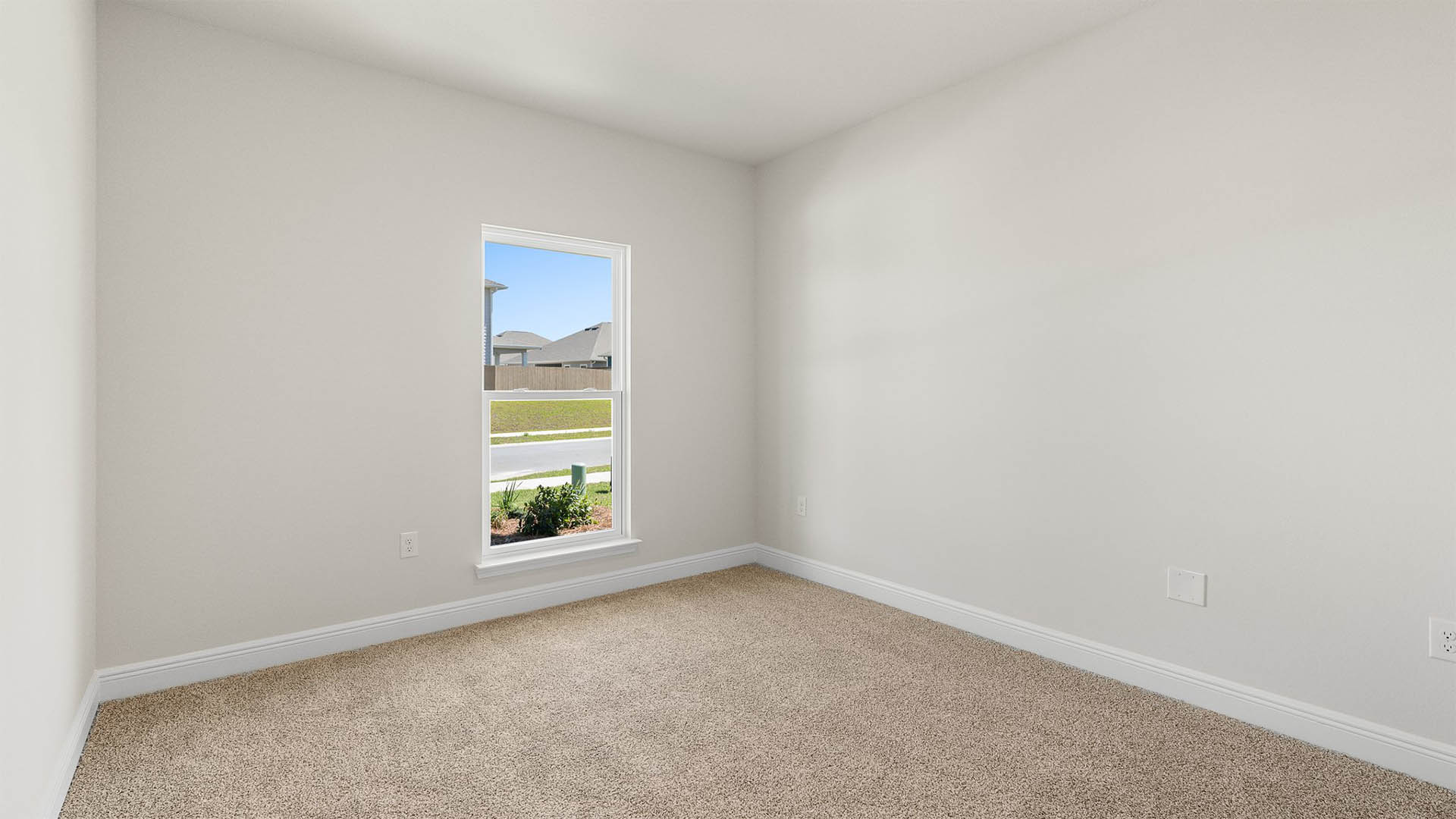 Bedroom with carpet floors and window.