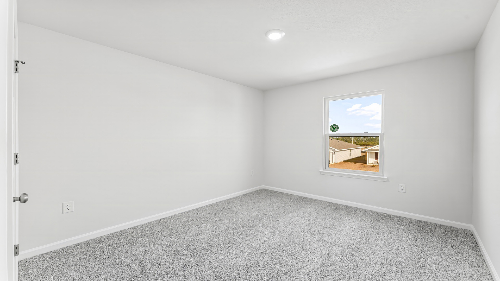 Bedroom with carpet floor and window.