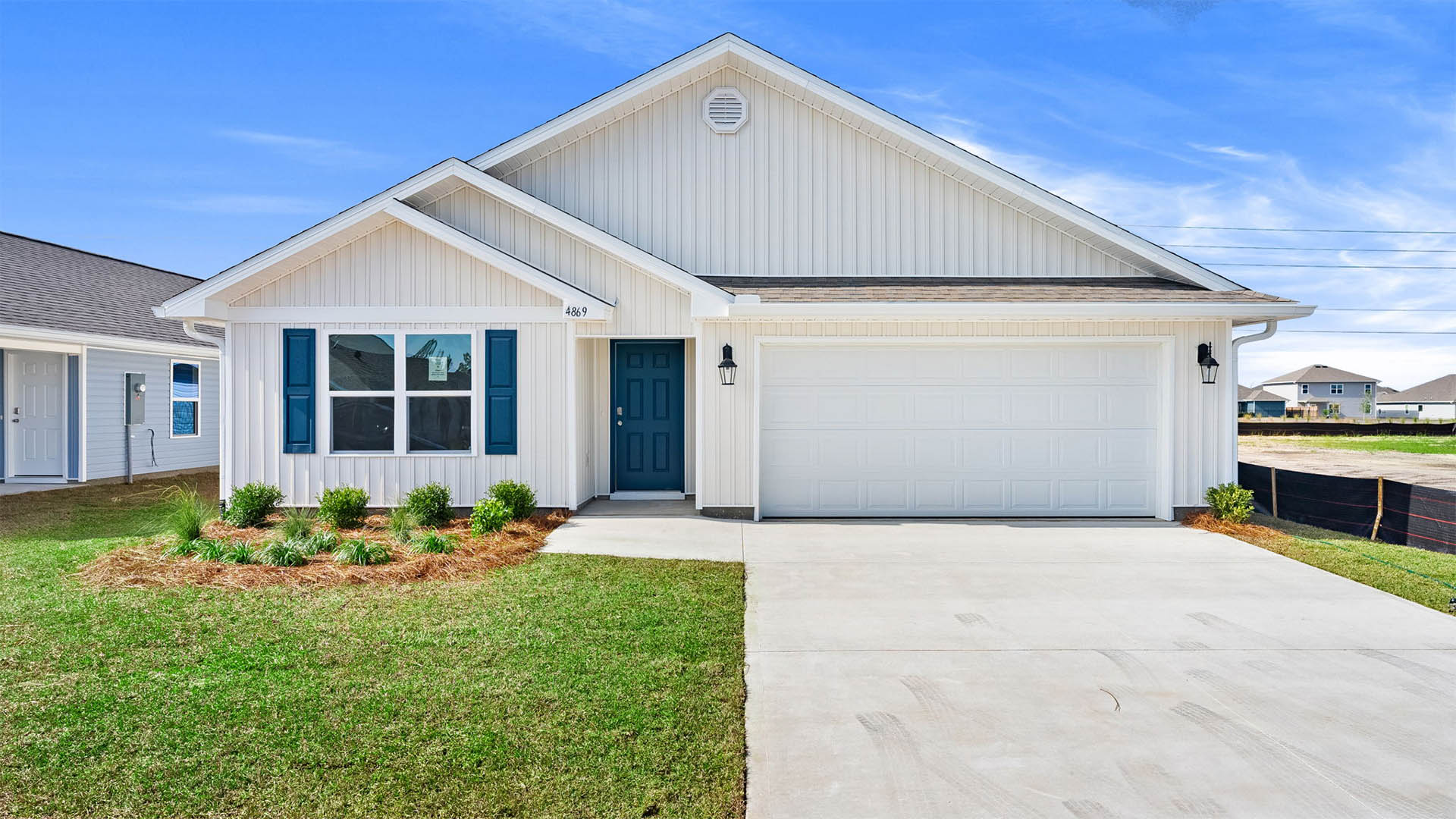 Cali floor plan with vinyl siding and two car garage.
