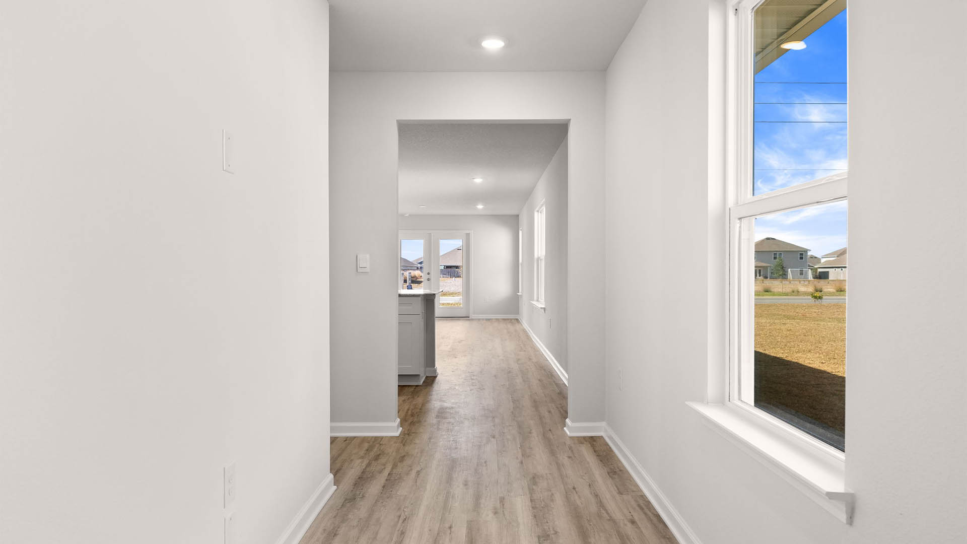 Front entrance hallway with EVP flooring and window.