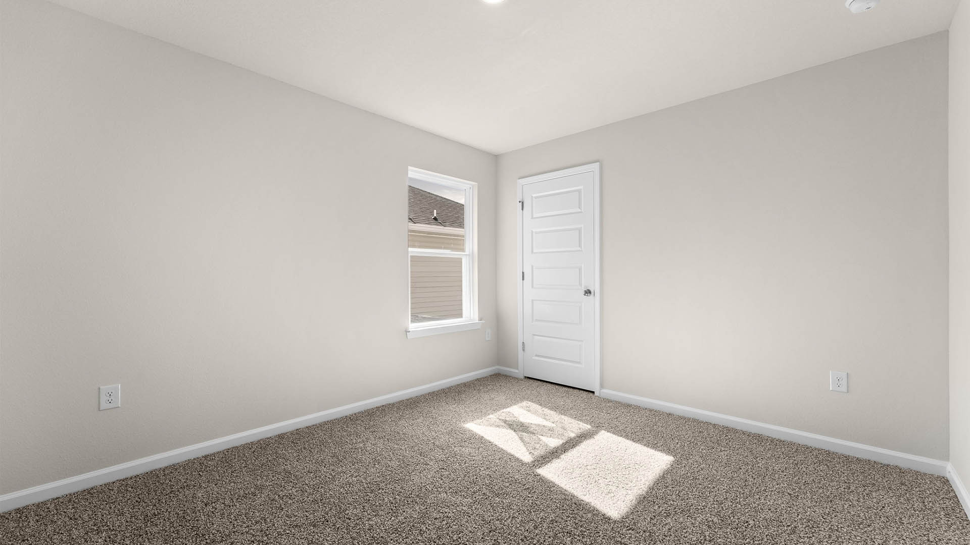 Bedroom with carpet floors and window and closet.