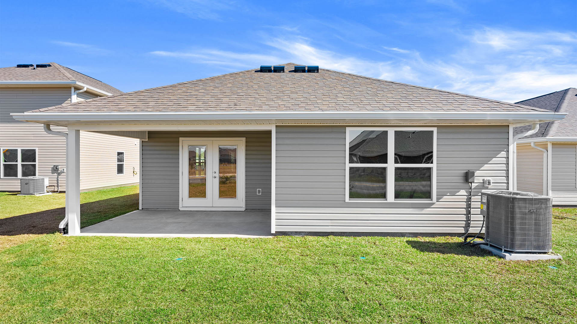 Jemison floor plan rear of home with covered back porch and yard.