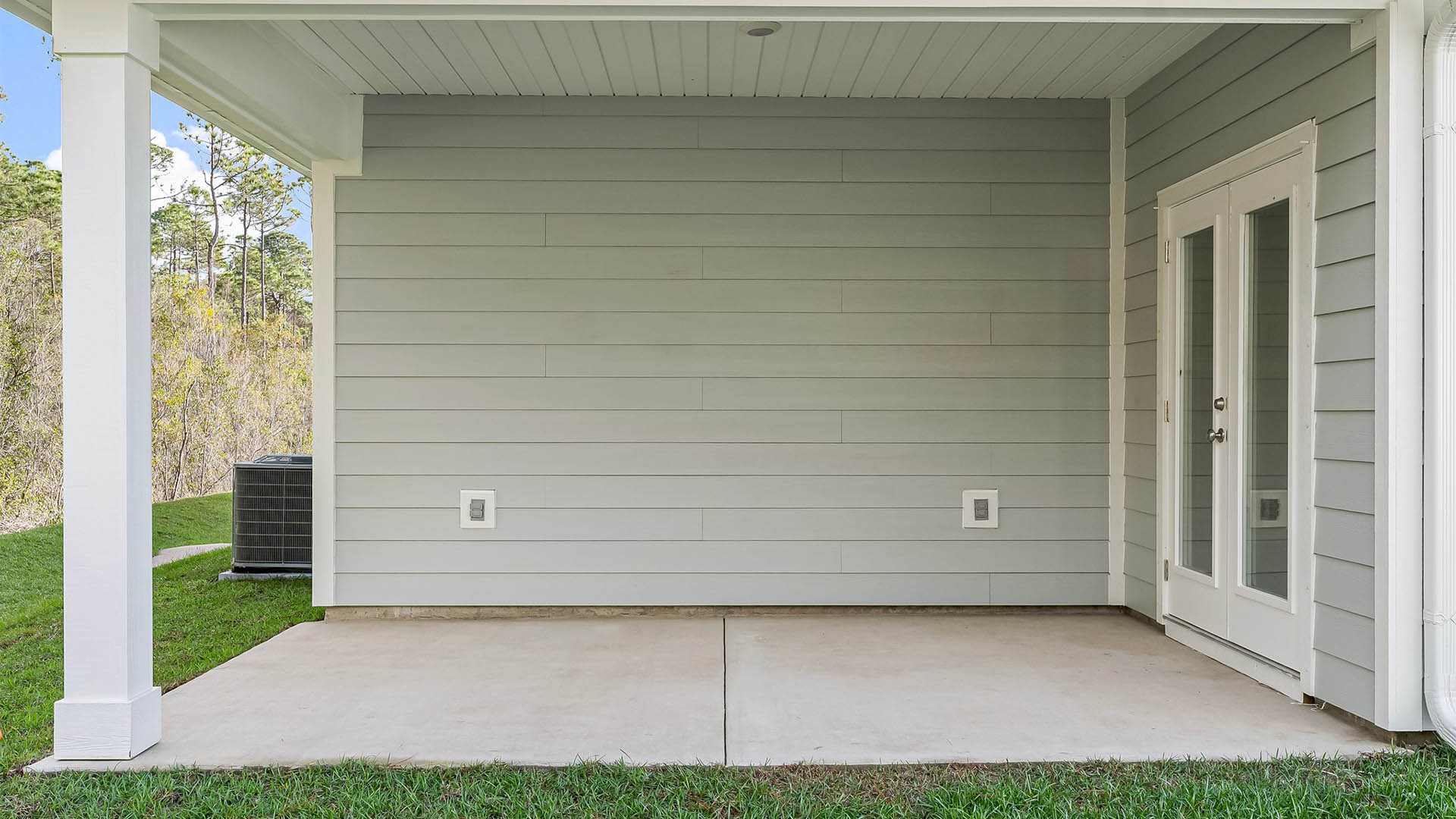Kennedy floor plan at Titus Park rear of home with covered back patio and back yard.