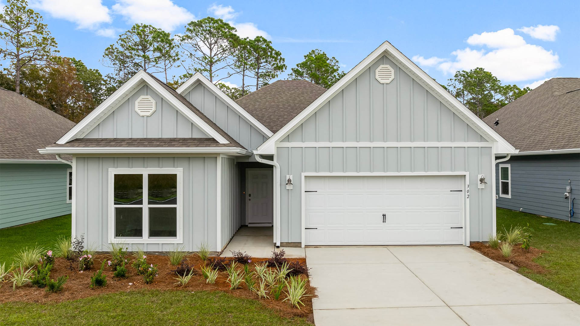 Kennedy floor plan at Titus Park with two-car garage and Hardie Board siding.