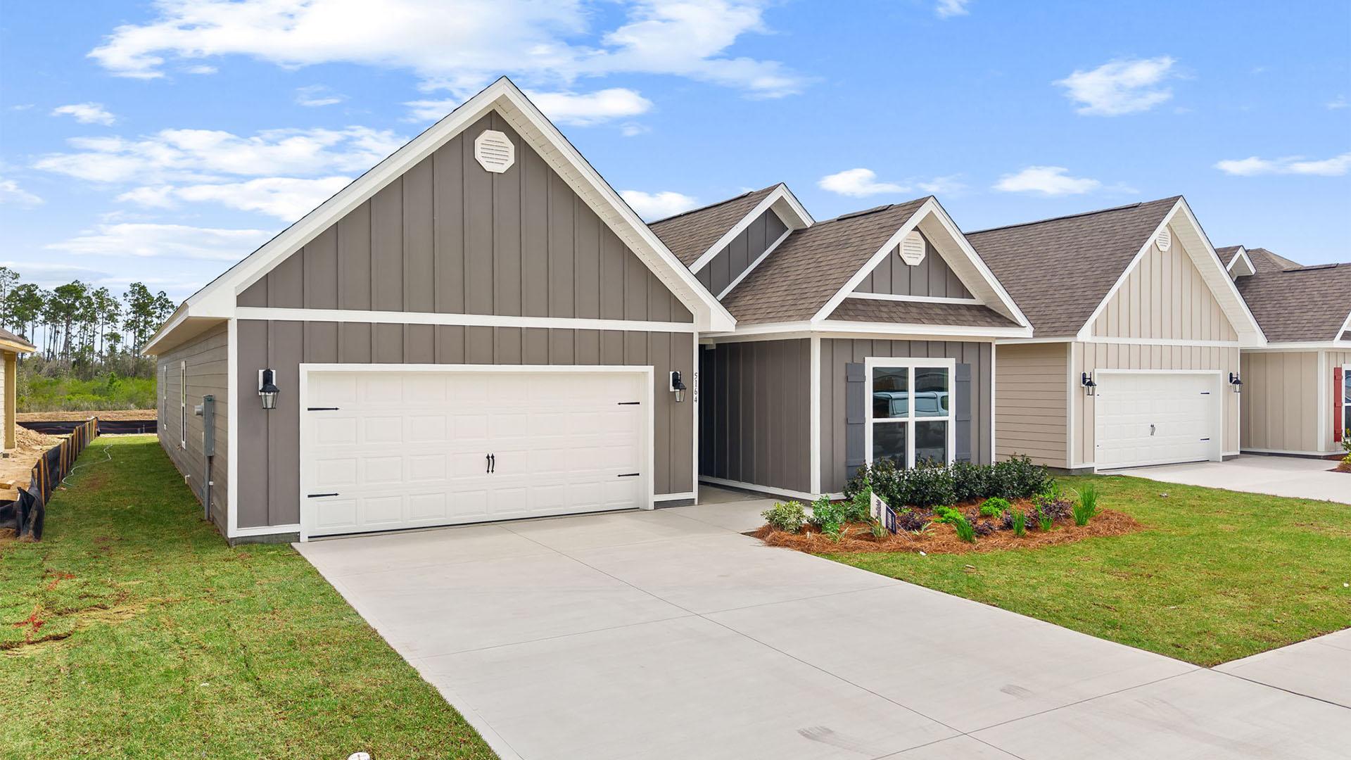 Kennedy floor plan at Titus Park with two-car garage and Hardie Board siding.