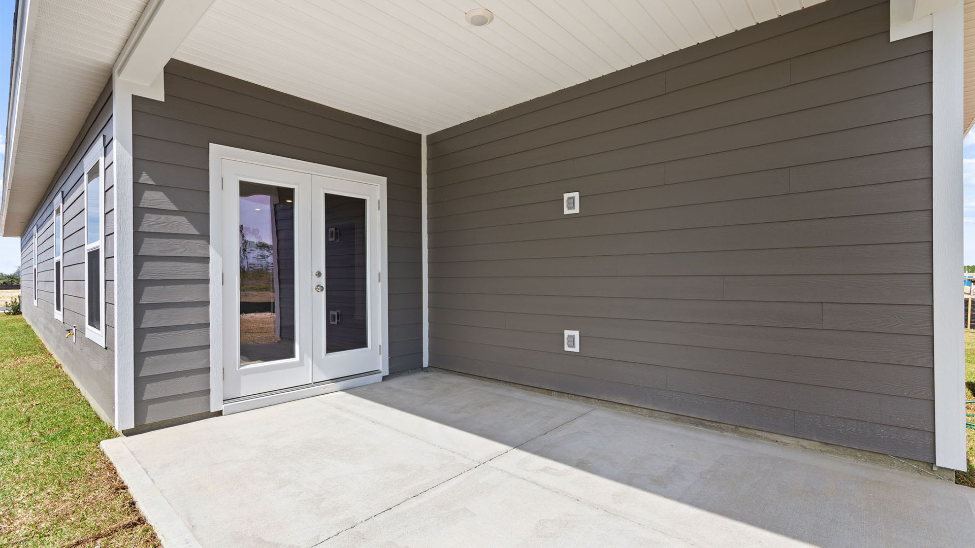 Covered back patio view and back yard.