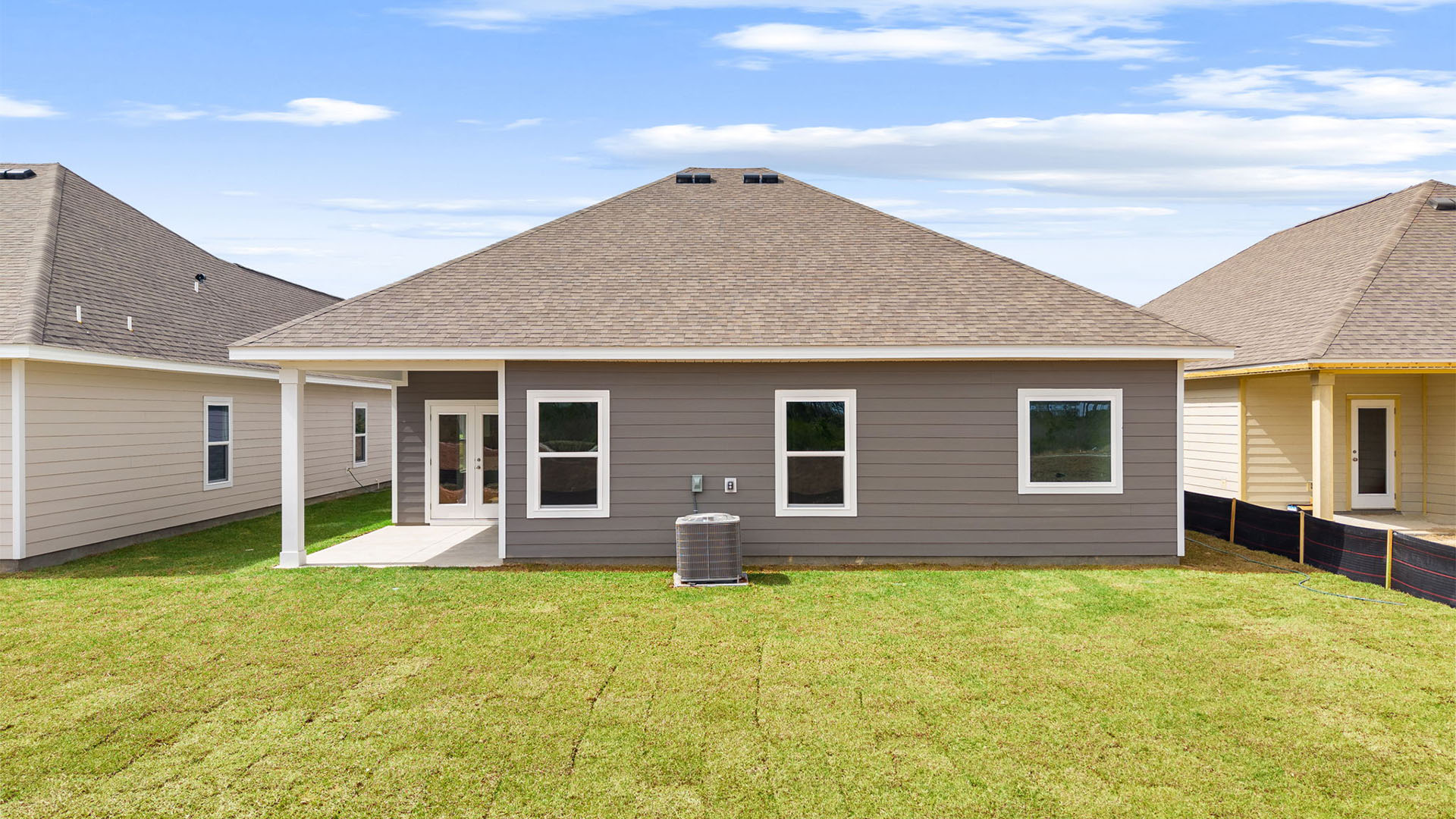 Kennedy floor plan at Titus Park rear of home with covered back patio and back yard.