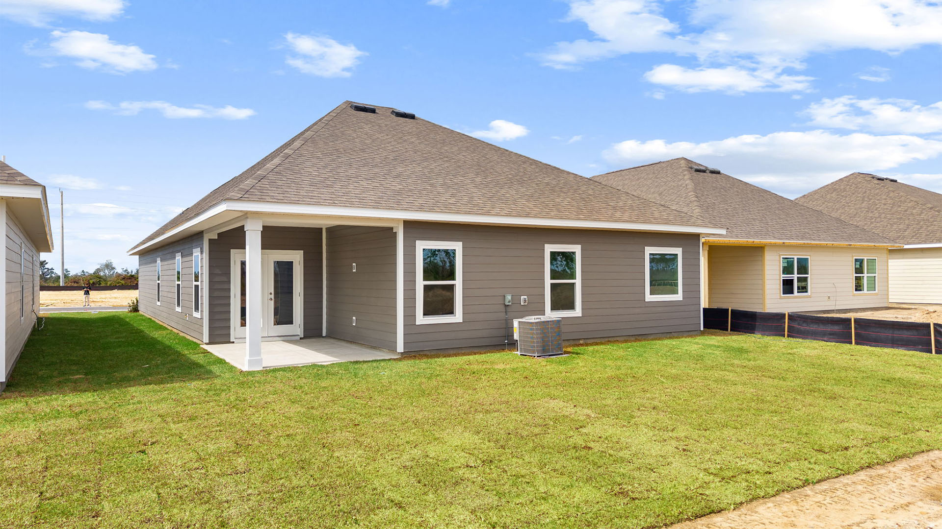 Kennedy floor plan at Titus Park rear of home with covered back patio and back yard.