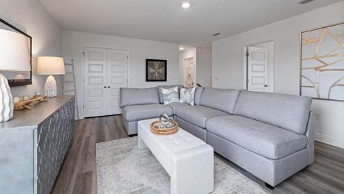 Upstairs common area with closet and bedroom entrances.