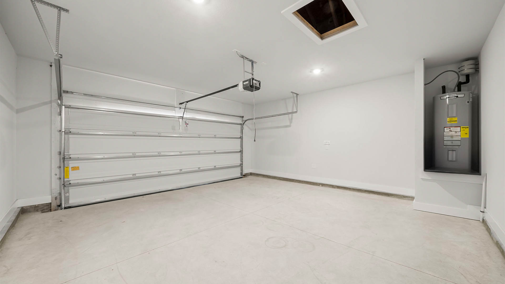 Two-car garage with water heater.