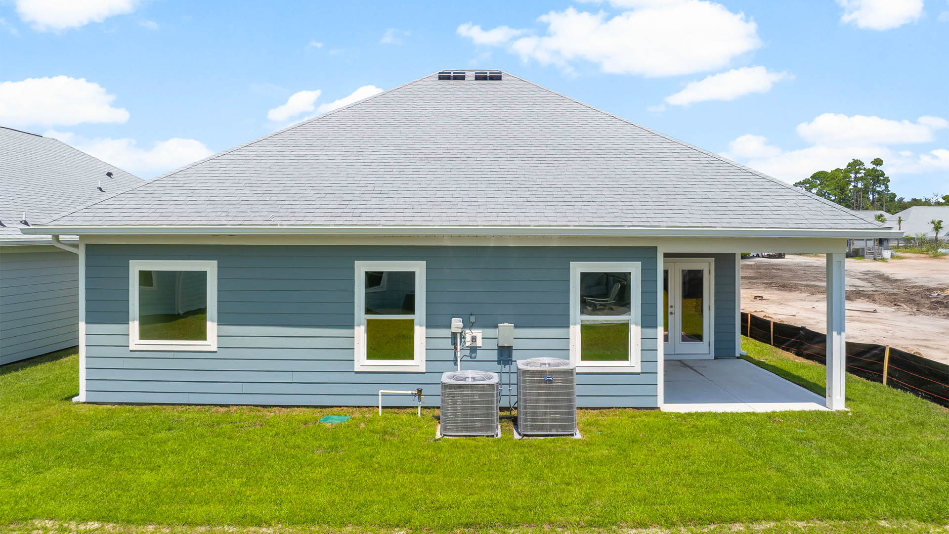 Kennedy floor plan at WindMark Beach rear of home with covered patio.